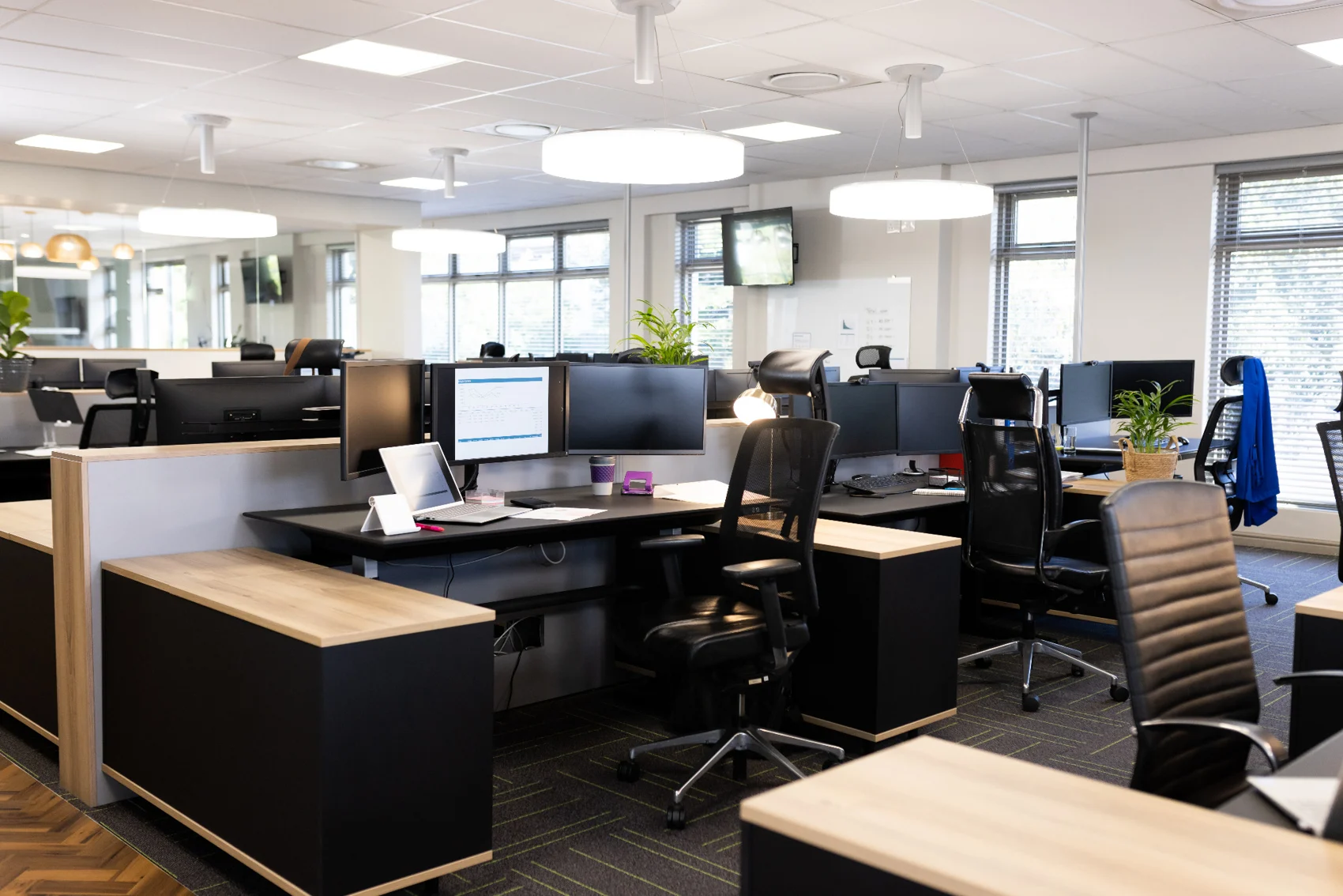 Corporate office with desks and computers