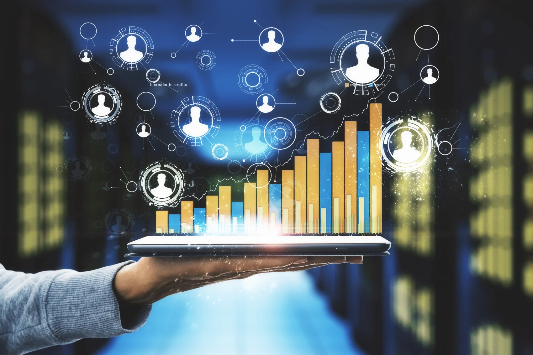 Tablet displaying connected business data and growth charts