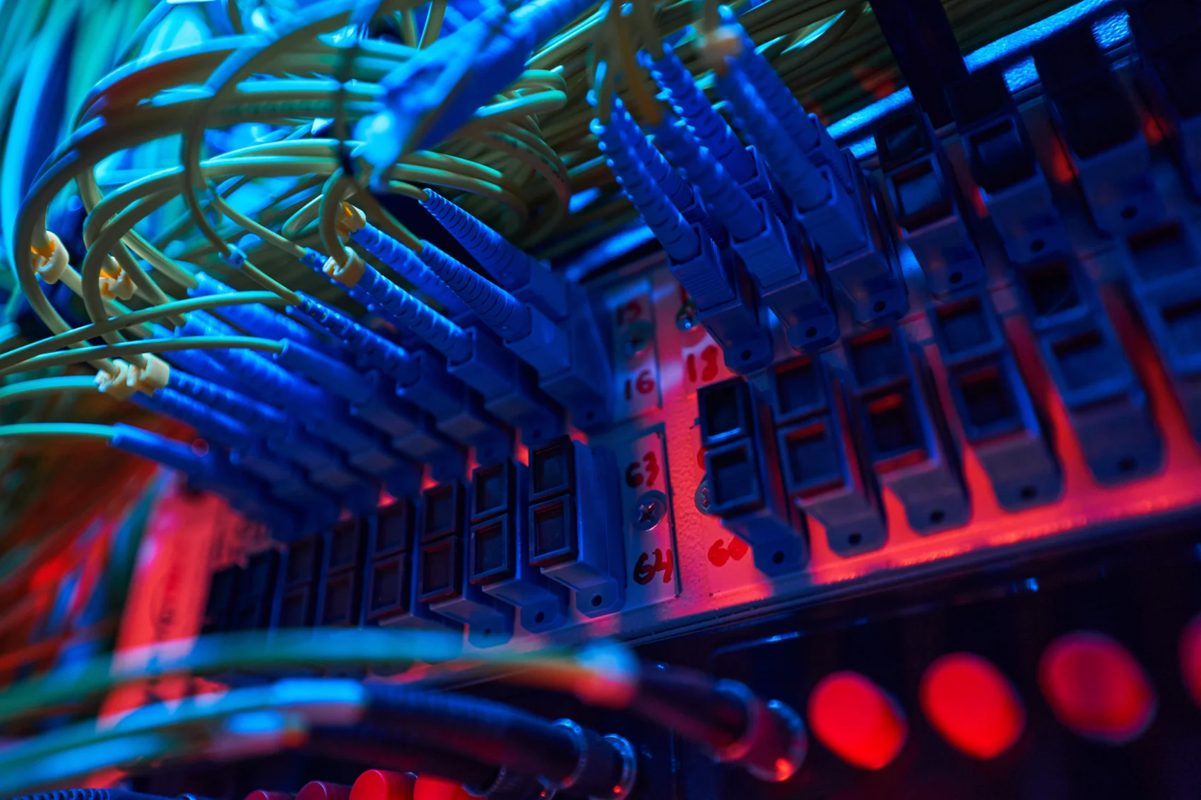 Network patch cables connected to illuminated ports