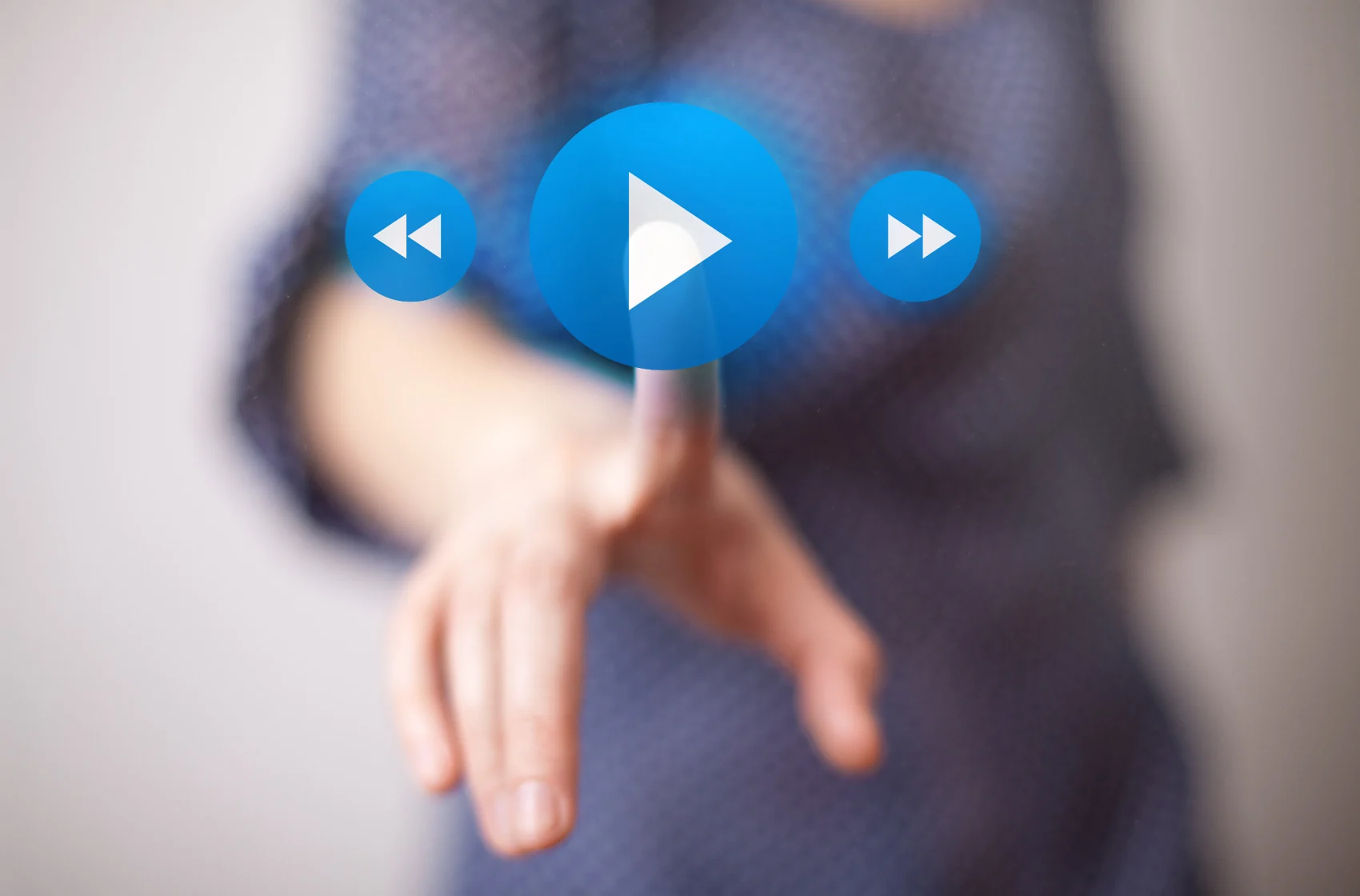 Hand selecting a digital video play control